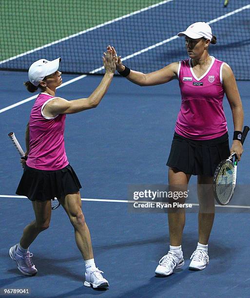 Cara Black of Zimbabwe and Liezel Huber of the USA celebrate during their second round doubles match against Svetlana Kuznetsova of Russia and...