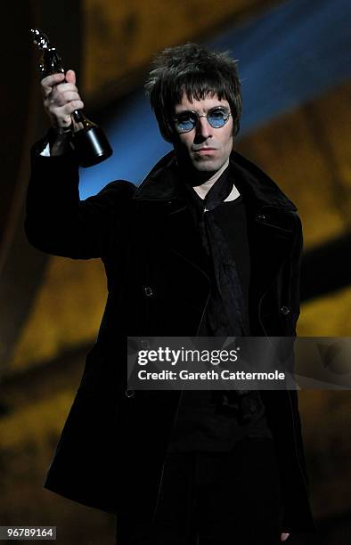 Liam Gallagher accepts Oasis' award for 'Best Album of 30 Years' on stage at The Brit Awards 2010 at Earls Court on February 16, 2010 in London,...