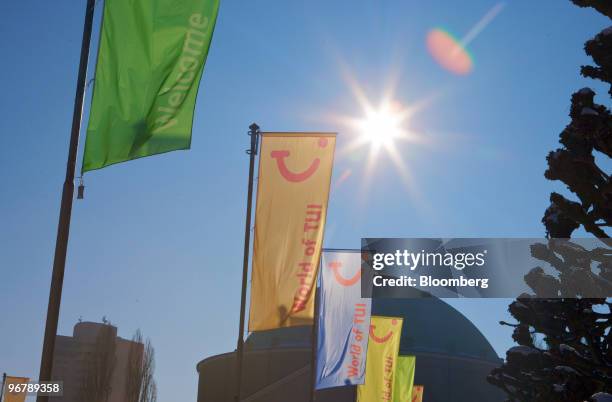 Flags wave outside the Congress Center during the TUI AG annual shareholders' meeting in Hannover, Germany on Wednesday, Feb.17, 2010. TUI AG's major...