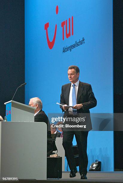 Michael Frenzel, chief executive officer of TUI AG , walks to the podium to speak during the company's annual shareholders' meeting in Hannover,...