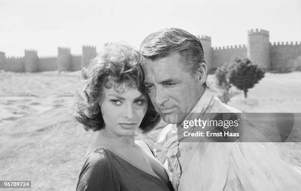 Cary Grant and Sophia Loren outside the walls of Avila, Spain, during location filming for 'The Pride and the Passion', directed by Stanley Kramer,...