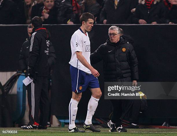 Michael Carrick of Manchester United leaves the pitch after receiving a red card during the UEFA Champions League round of 16 first leg match between...