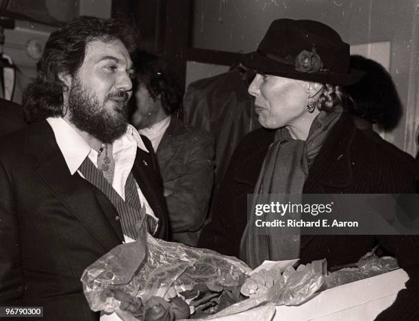 Dr John presents Joni Mitchell with flowers backstage in New York in 1977