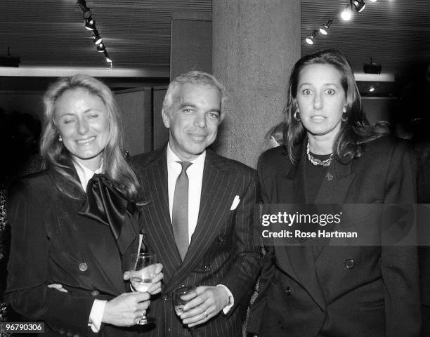 Ricky and Ralph Lauren stand next to Donna Karan at a Sotheby's preview, New York, 1985.