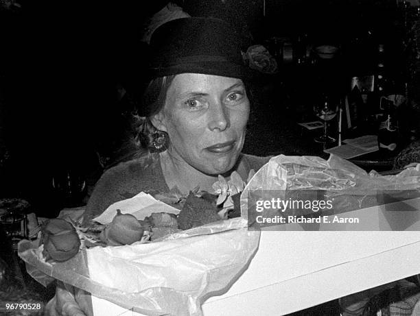 Joni Mitchell with flowers backstage in New York in 1977