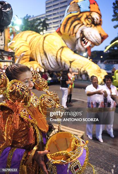 Revelers of the Porto da Pedra samba school get ready at the "concentration area" February 16, 2010 before the carnival parade at the Sambodrome in...