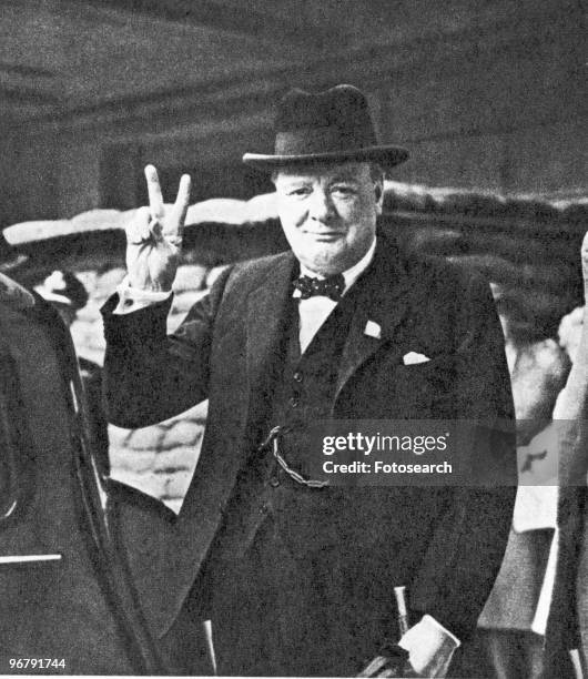 Portrait of Prime Minister Winston Churchill showing his victory sign, circa 1941. .