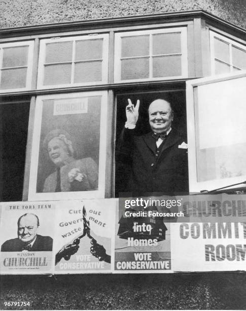 Portrait of Prime Minister Winston Churchill giving his victory sign from an open window, during the 1951 General Election Campaign. .