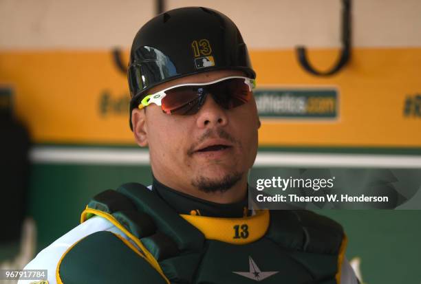 Bruce Maxwell of the Oakland Athletics looks on from the dugout against the Tampa Bay Rays in the bottom of the second inning at the Oakland Alameda...