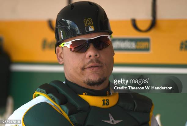 Bruce Maxwell of the Oakland Athletics looks on from the dugout against the Tampa Bay Rays in the bottom of the second inning at the Oakland Alameda...