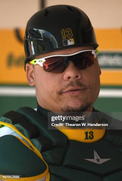 Bruce Maxwell of the Oakland Athletics looks on from the dugout against the Tampa Bay Rays in the bottom of the second inning at the Oakland Alameda...