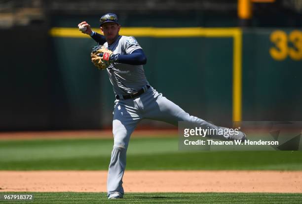 Daniel Robertson of the Tampa Bay Rays throws off balance to first base thowing out Bruce Maxwell of the Oakland Athletics in the bottom of the six...