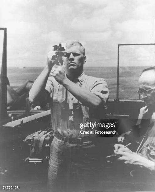 Young President Gerald Ford taking reading aboard the USS MONTEREY navy ship, circa 1935. .