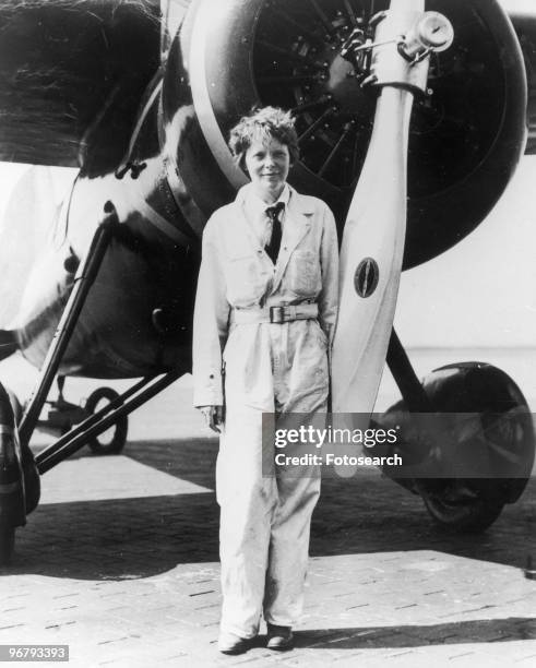 Amelia Earhart in front of her Lockheed plane Electra, circa 1933. .