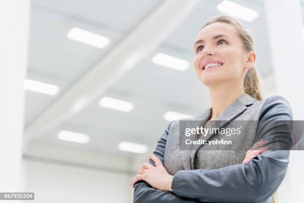 business leader at warehouse smiling - yoh4nn stock pictures, royalty-free photos & images