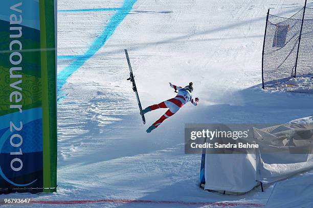 Dominique Gisin of Switzerland falls down the course during the Alpine Skiing Ladies Downhill on day 6 of the Vancouver 2010 Winter Olympics at...