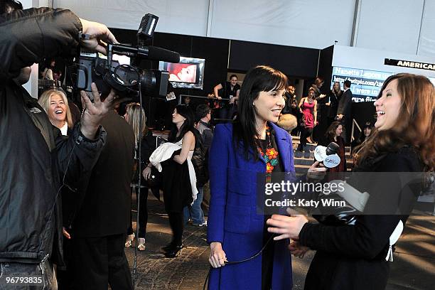 Reporter Fabiola Beracasa interviews a fashion goer during Mercedes-Benz Fashion Week at Bryant Park on February 17, 2010 in New York City.