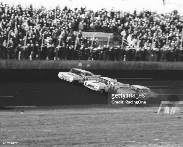 Winner Lee Petty edges his Oldsmobile past the Ford Thunderbird of Johnny Beauchamp to win the first Daytona 500. Beauchamp was initially flagged the...