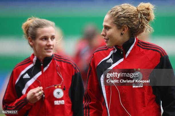 Simone Laudehr and Kim Kulig of Germany are seen before the Women's international friendly match between Germany and North Korea at the MSV Arena on...