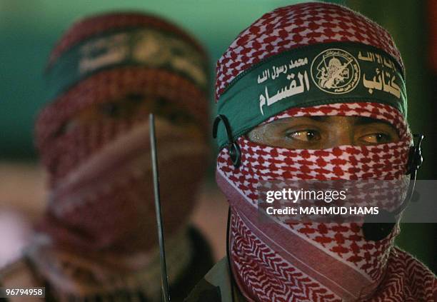 Hamas militants from the group's military wing parade during a rally to honour the Islamic movement's assassinated top commander Mahmud al-Mabhuh in...