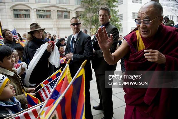Exiled Tibetan spiritual leader the Dalai Lama participates in a Tibetan New Year celebration as he arrives at the Park Hyatt hotel in Washington,...