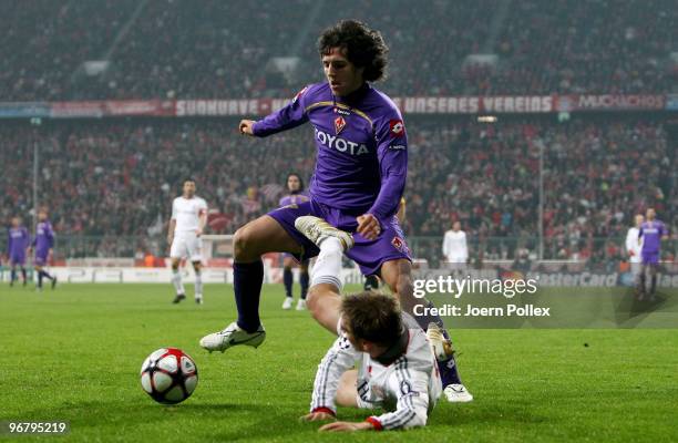 Philipp Lahm of Bayern competes with Stevan Jovetic of Florence during the UEFA Champions League round of sixteen, first leg match between FC Bayern...