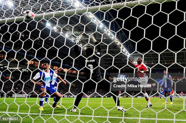 Sol Campbell of Arsenal heads his teams first goal of the game past goalkeeper Helton of Porto during the UEFA Champions League last 16 first leg...