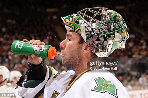 Goaltender Marty Turco of the Dallas Stars gets a drink during a stop in play against the Phoenix Coyotes on February 13, 2010 at Jobing.com Arena in...