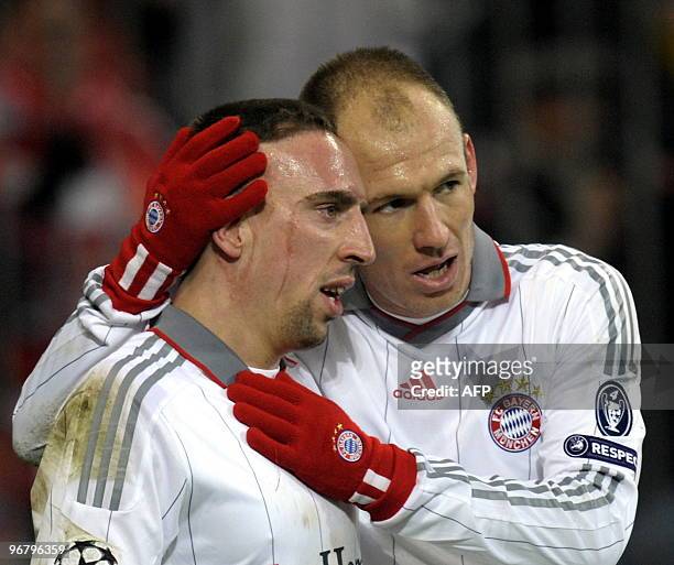 Bayern Munich's Dutch striker Arjen Robben celebrates scoring a penalty with Bayern Munich's French midfielder Franck Ribery during the 1st leg UEFA...