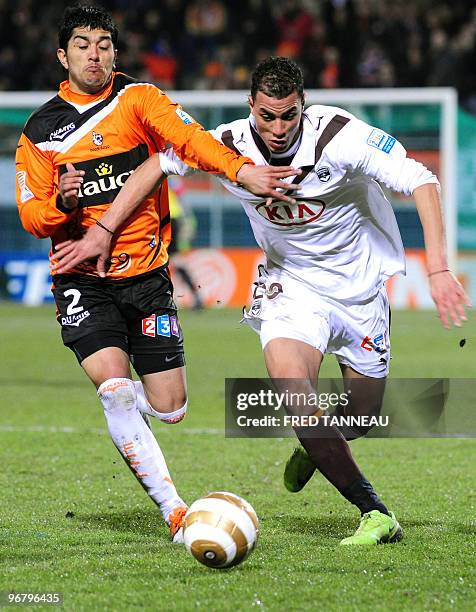 Bordeaux' defender Marouane Chamakh vies with Lorient's defender Franco Sosa during the French League Cup football match Lorient vs. Bordeaux on...