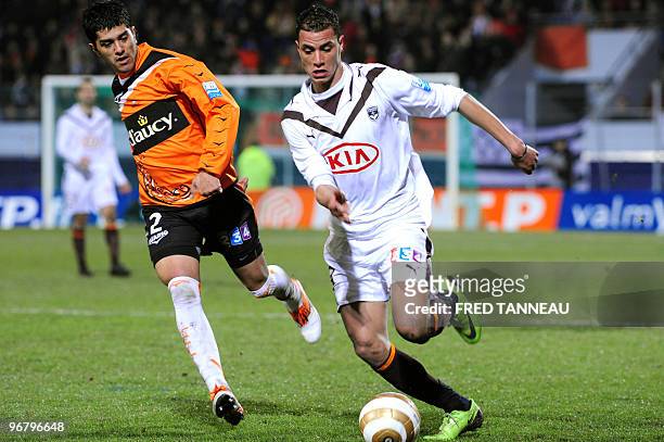 Bordeaux' defender Marouane Chamakh vies with Lorient's defender Franco Sosa during the French League Cup football match Lorient vs. Bordeaux on...