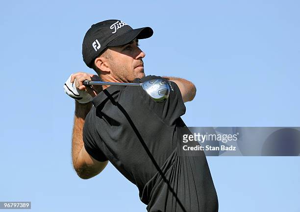 Geoff Ogilvy of Australia hits from the ninth tee box during the first round of the World Golf Championships-Accenture Match Play Championship at The...