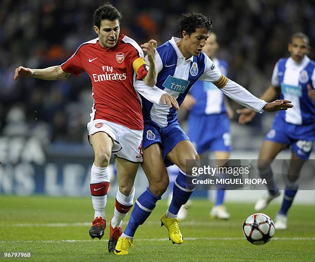 Arsenal's Spanish midfielder Cesc Fabregas vies with FC Porto's defender Bruno Alves during their UEFA Champions League football match at the Dragao...