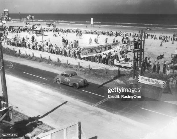 Tim Flock crosses the start-finish line during one of the early races on the Daytona Beach-Road Course.