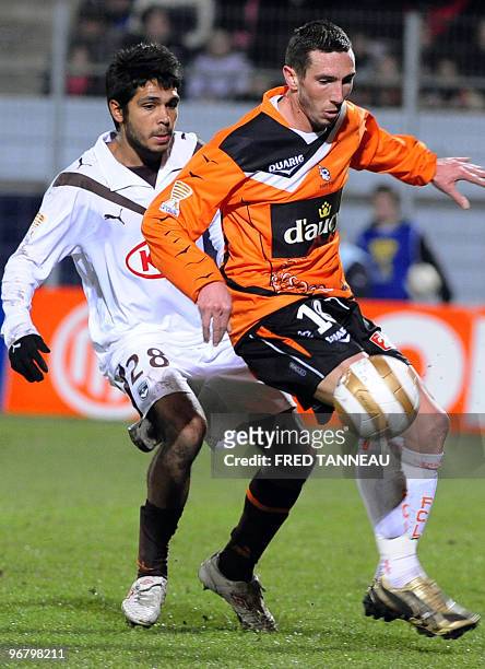 Bordeaux' defender Benoit Tremoulinas vies with Lorient's midfielder Morgan Amalfitano during the French League Cup football match Lorient vs....
