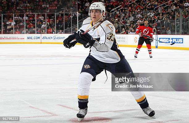 Colin Wilson of the Nashville Predators skates against the New Jersey Devils at the Prudential Center on February 12, 2010 in Newark, New Jersey. The...