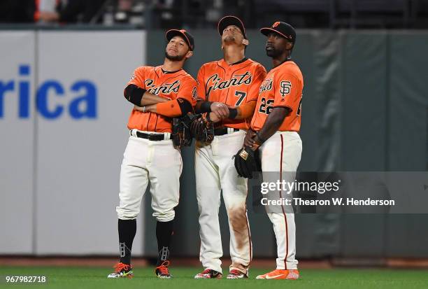 Gregor Blanco, Gorkys Hernandez and Andrew McCutchen of the San Francisco Giants celebrates defeating the Philadelphia Phillies 4-0 at AT&T Park on...