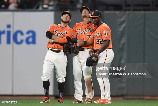 Gregor Blanco, Gorkys Hernandez and Andrew McCutchen of the San Francisco Giants celebrates defeating the Philadelphia Phillies 4-0 at AT&T Park on...