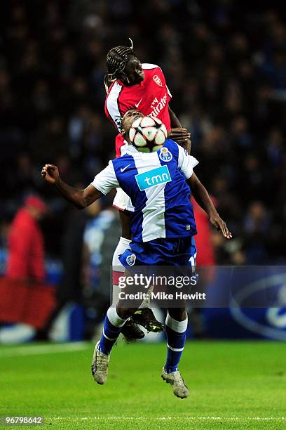 Varela of FC Porto and Bacary Sagna of Arsenal battle for the header during the UEFA Champions League last 16 first leg match between FC Porto and...