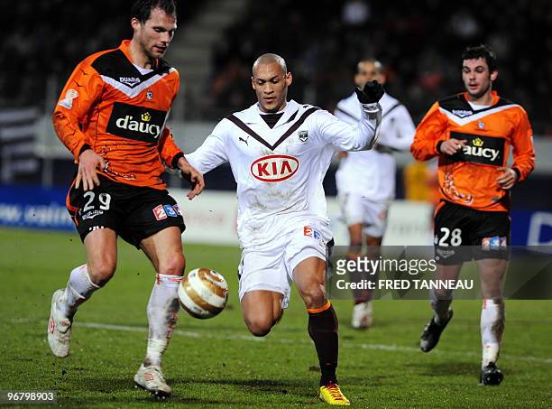 Bordeaux' midfielder Yoan Gouffran vies with Lorient's defender Sylvain Marchal and midfielder Pierre ducasse during the French League Cup football...