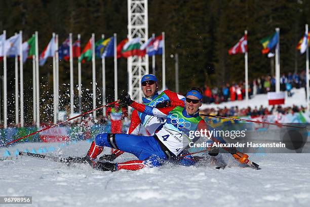 Nikita Kriukov and Alexander Panzhinskiy of Russia celebrate as they fall down after crossing the finish line to finish first and second in the Men's...