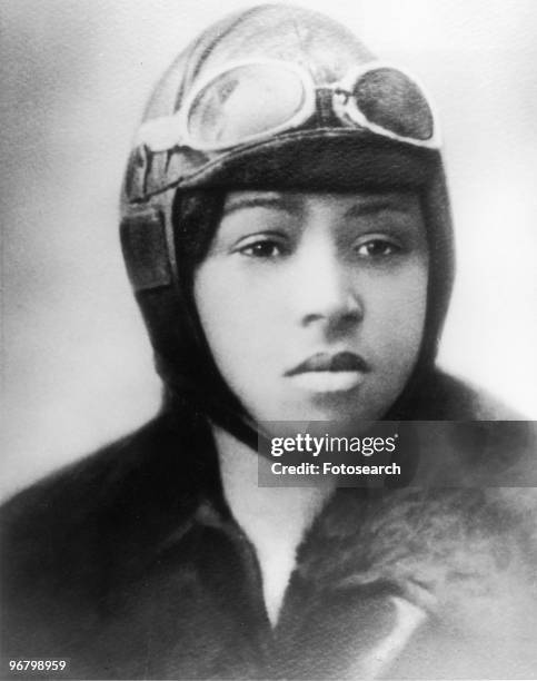 Portrait of aviatrix Bessie Coleman wearing flying helmet and goggles, circa 1920s. .