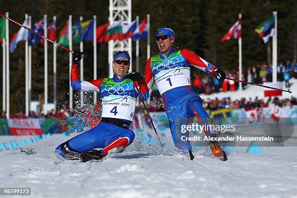 Nikita Kriukov and Alexander Panzhinskiy of Russia celebrate as they fall down after crossing the finish line to finish first and second in the Men's...