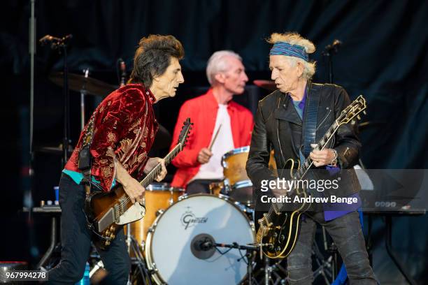 Ronnie Wood, Charlie Watts and Keith Richards of The Rolling Stones perform live on stage at Old Trafford on June 5, 2018 in Manchester, England.