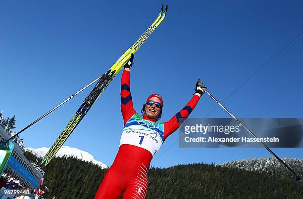 Marit Bjoergen of Norway celebrates after she finished first to win the gold medal in the Women's Individual Sprint C Final on day 6 of the 2010...