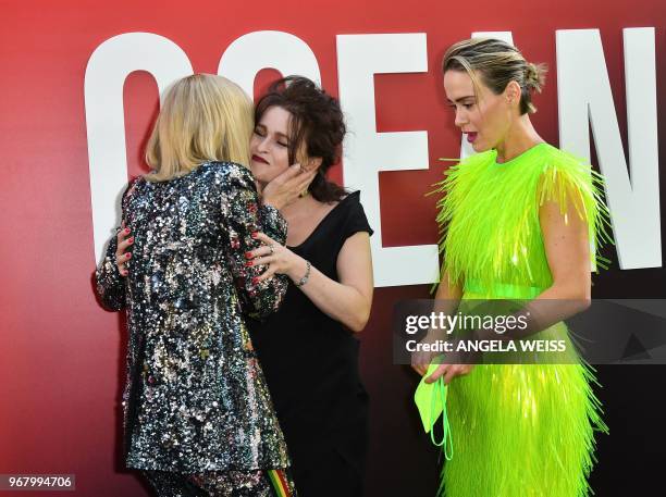 British actress Helena Bonham Carter gets a kiss from Australian actress Cate Blanchett as US actress Sarah Paulson looks on as they arrive for the...