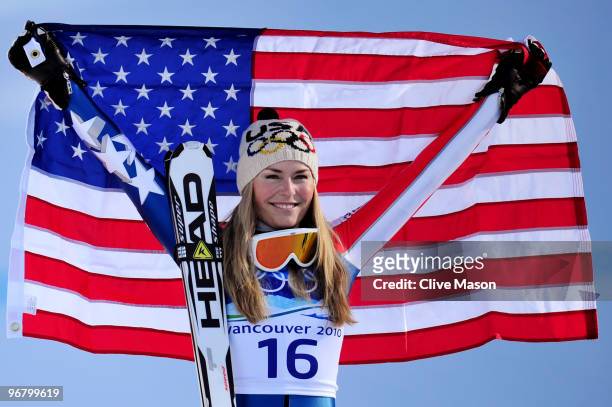 Lindsey Vonn of the United States celebrates winning the gold medal during the flower ceremony for the Alpine Skiing Ladies Downhill on day 6 of the...