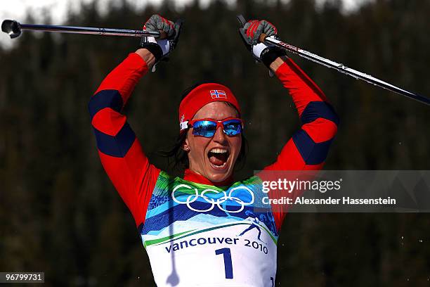 Marit Bjoergen of Norway celebrates after she finished first to win the gold medal in the Women's Individual Sprint C Final on day 6 of the 2010...