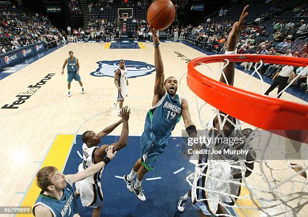 Wayne Ellington of the Minnesota Timberwolves shoots a layup against Lester Hudson and Hasheem Thabeet of the Memphis Grizzlies during the game at...