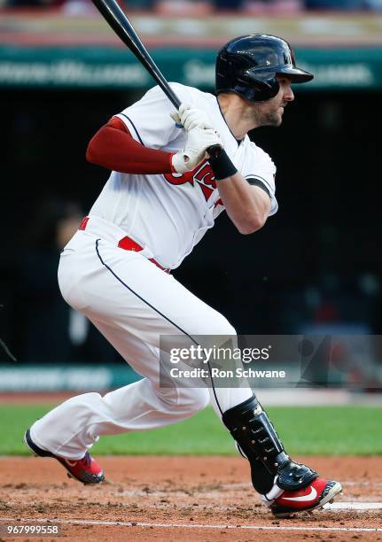 Lonnie Chisenhall of the Cleveland Indians hits a two RBI single off starting pitcher Junior Guerra of the Milwaukee Brewers during the second inning...